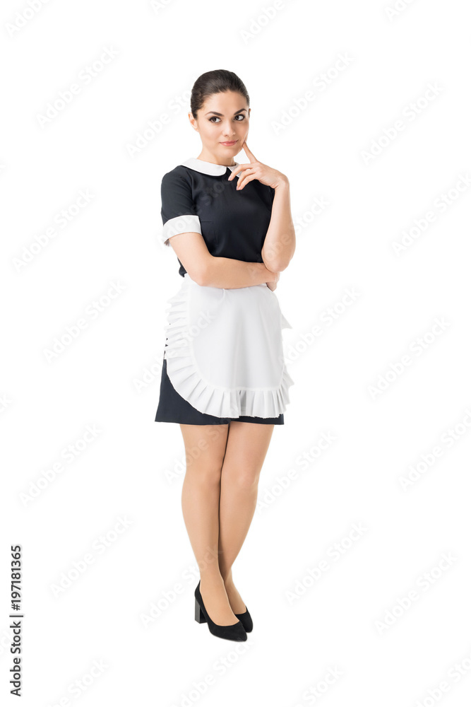 Brunette maid in professional uniform with hand by face isolated on white Brunette maid in professional uniform with hand by face isolated on white