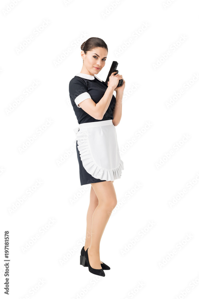 Smiling maid in uniform holding gun isolated on white Smiling maid in uniform holding gun isolated on white