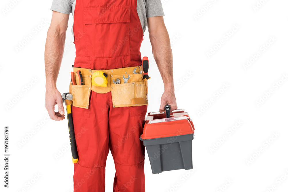 Close-up view of handyman holding toolbox isolated on white Close-up view of handyman holding toolbox isolated on white