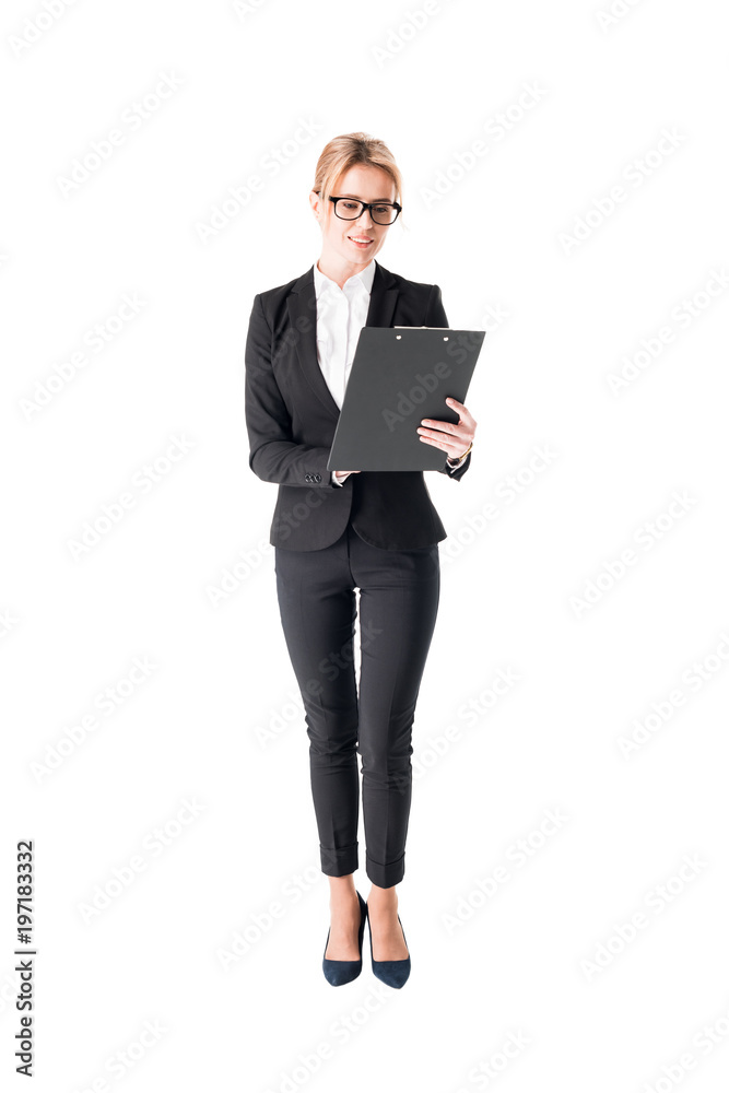 Blonde businesswoman looking at clipboard isolated on white