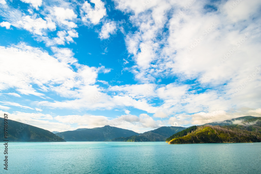 Naklejka premium Landscape of the Mountain and sea with cloudy in the morning. View from the ferry to South Island, New Zealand.