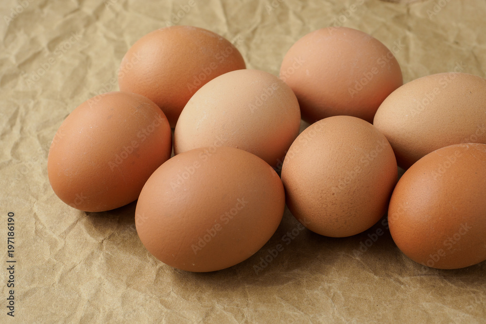 Fresh eggs on brown wrapping paper. Dietary products. Organic fresh eggs. Fresh eggs on brown wrapping paper. Dietary products. Organic fresh eggs.
