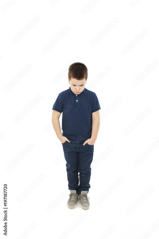 Angry little boy with hand in pockets. Isolated on white background Angry little boy with hand in pockets. Isolated on white background