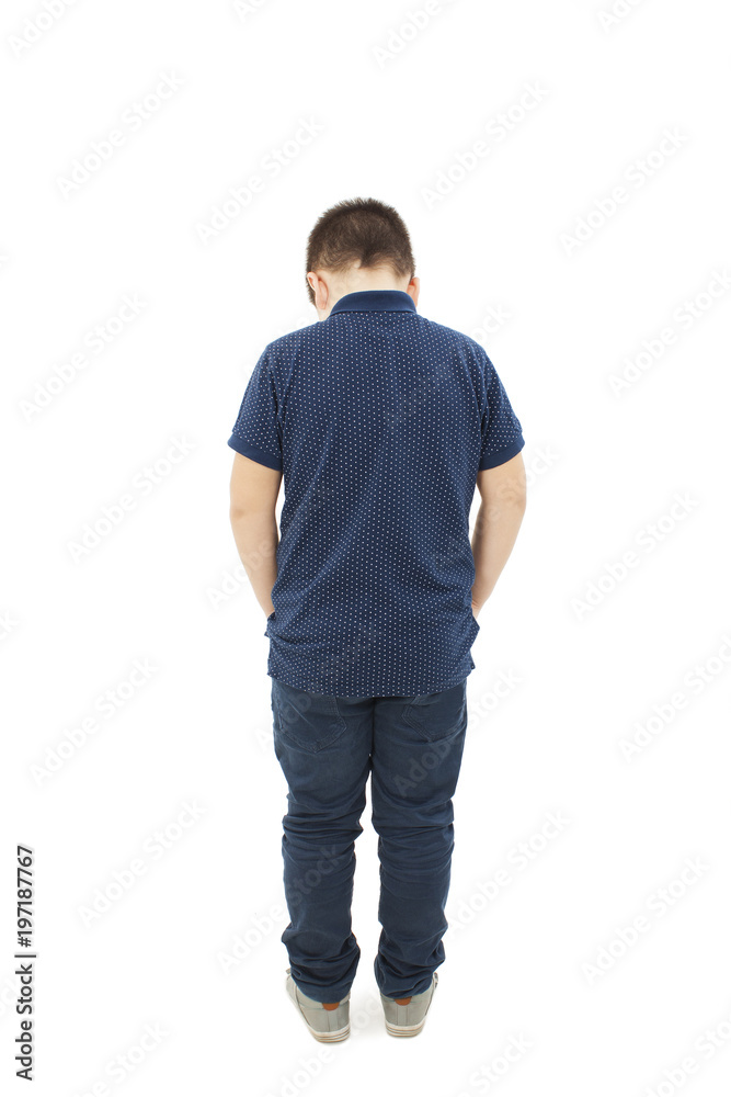 Rear view of modern little boy, standing with hands in pockets. Isolated on white background Rear view of modern little boy, standing with hands in pockets. Isolated on white background