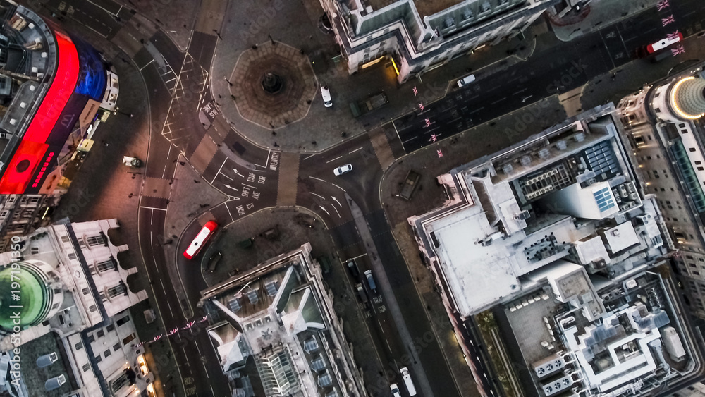 Bird's Eye View Flying Over Piccadilly Circus and Aerial View of London City Streets at Night in London England 4K