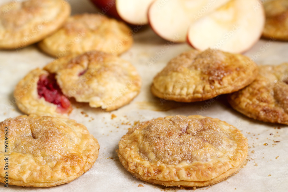 Crispy mini pies with apple and red currant. Rustic style.