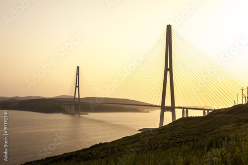 Cable-stayed bridge "Russky Bridge" to island Russkiy on the sunset. Vladivostok, Primorsky Krai, Russia