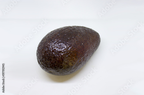 Whole black avocado