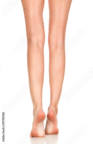 Closeup shot of female bare feet, isolated on white background © Nobilior