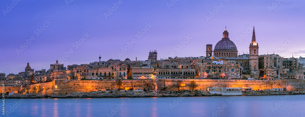 Panoramic skyline of illuminated Valletta in Malta