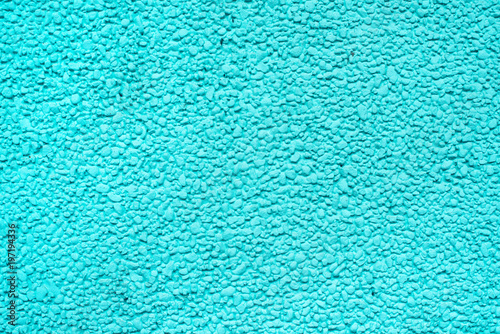 Rough cement wall surface in cyan tone