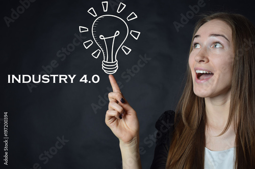 A businessman shows an inscription:INDUSTRY 4.0