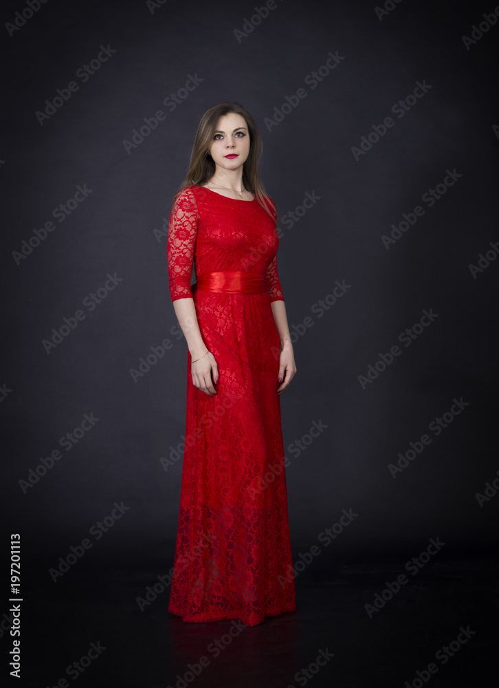 Portrait of a beautiful girl in a red dress. Portrait of a beautiful girl in a red dress.