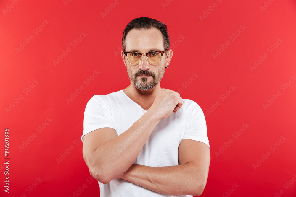 Adult serious man in colorful sunglasses Adult serious man in colorful sunglasses