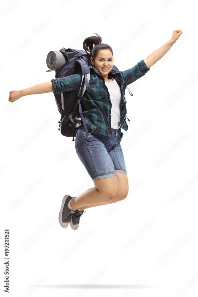 Female teen tourist jumping and gesturing happiness