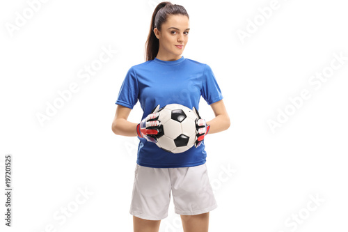 Female goalkeeper holding a football