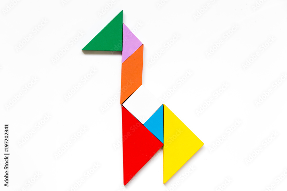 Color wood tangram puzzle in giraffe shape on white background Color wood tangram puzzle in giraffe shape on white background