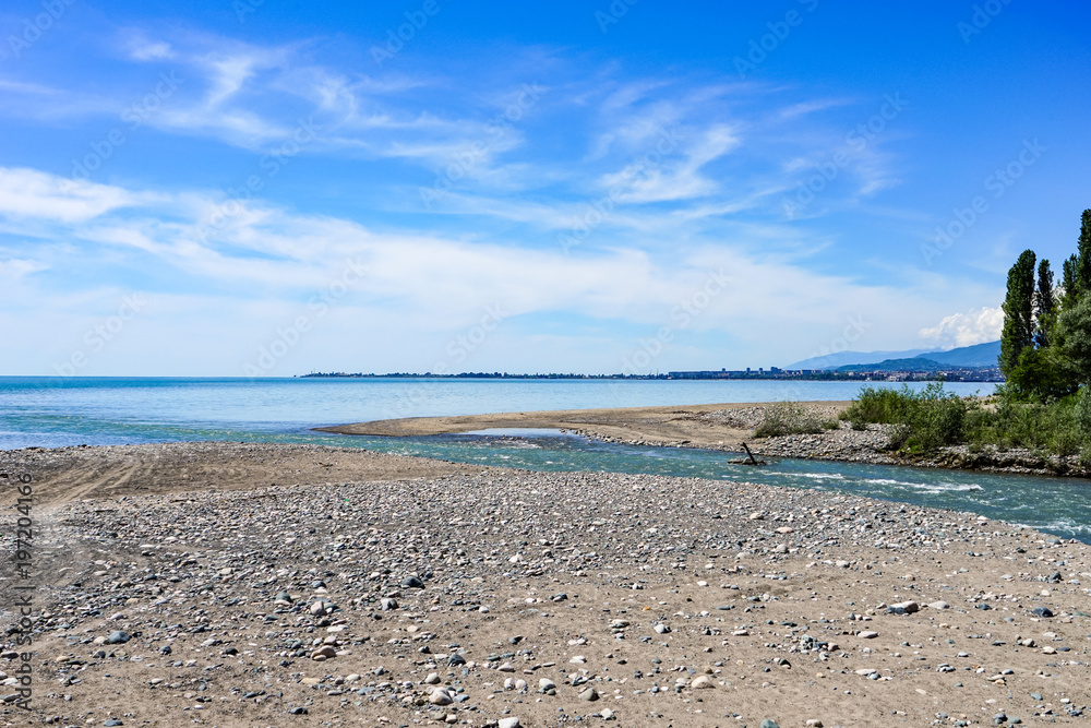 Natural landscape with views of the river flowing into the sea.