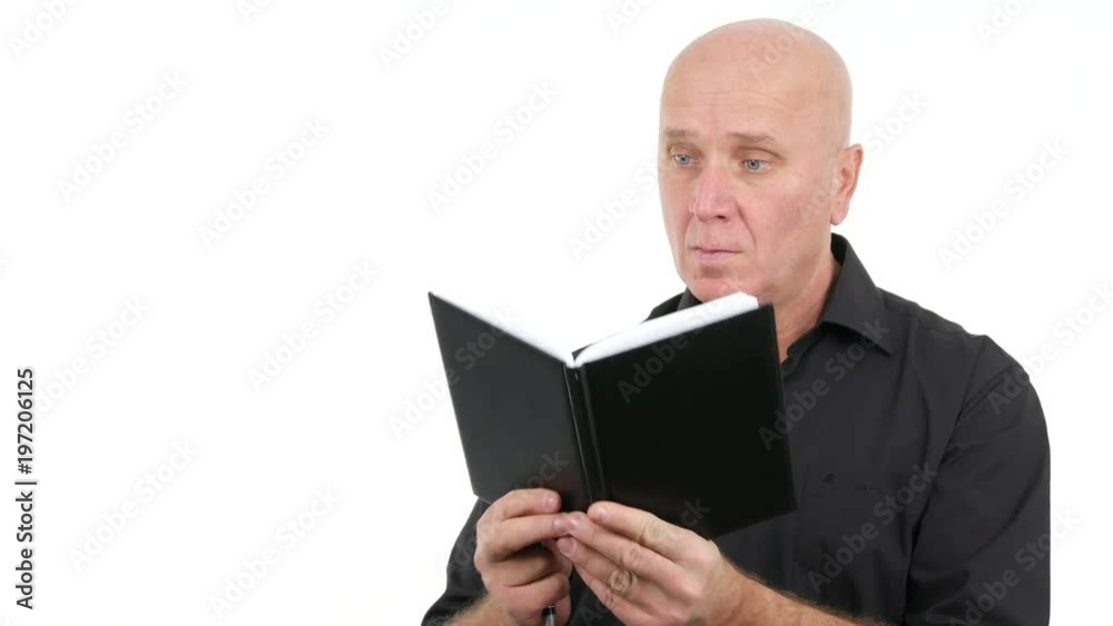 Businessperson Wearing Casual Black Shirt Take Notes Writing in Agenda Businessperson Wearing Casual Black Shirt Take Notes Writing in Agenda