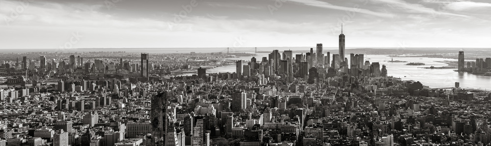 Aerial panoramic view of Lower Manhattan in Black and White. The view includes Financial District skyscrapers, East and West Village, the Hudson River, New York Harbor, and Brooklyn, New York City