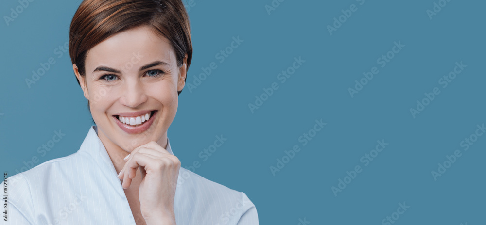 Confident beautiful woman posing and smiling Confident beautiful woman posing and smiling