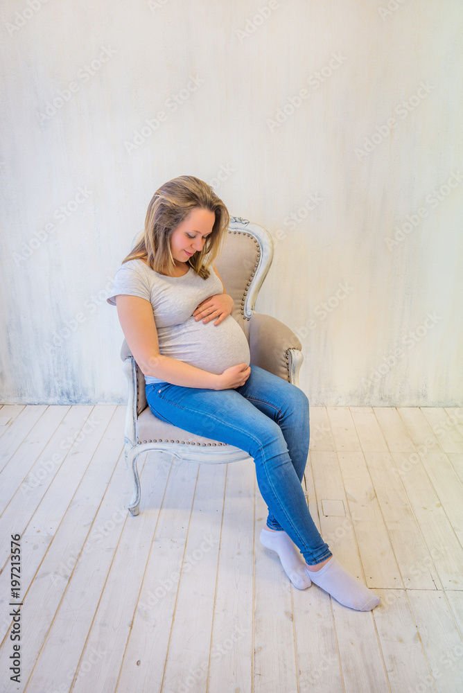 Young pregnant woman sitting Young pregnant woman sitting