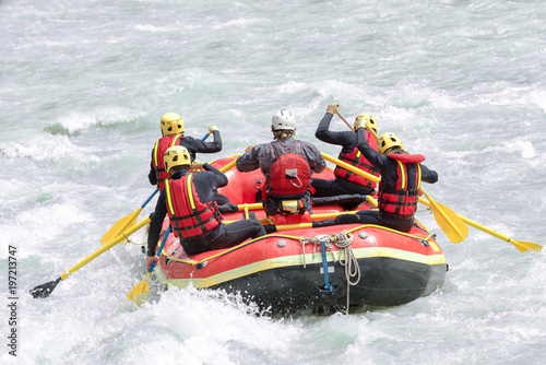 Group of people rafting on white water, active vacations, team concept