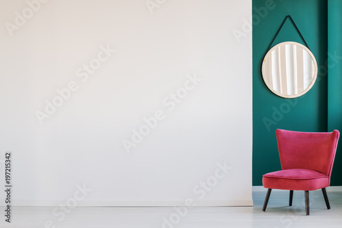 Empty wall and armchair
