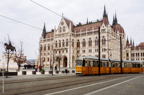Budapest,Hungary March 2016. Front view of Parliament building and the yellow tram in Budapest,Hungary