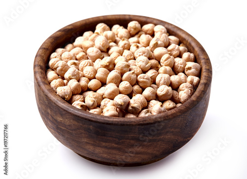 Chickpeas in wooden bowl isolated on white