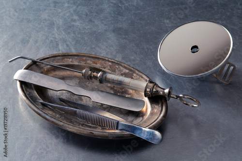 Instruments of the otolaryngologist on a silver tray