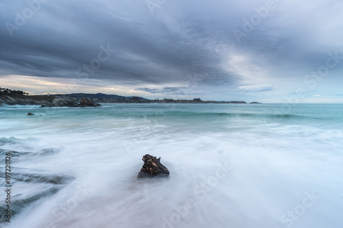 afternoon of clouds on the beach of Arnao photo