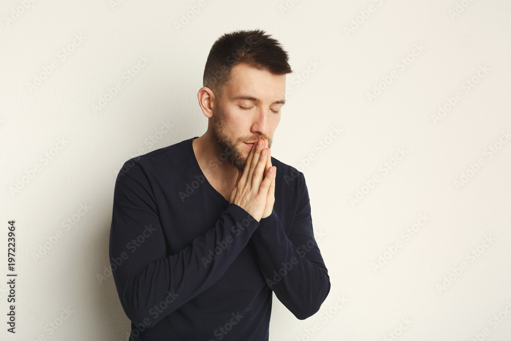 Portrait of hopeful man praying, headshot Portrait of hopeful man praying, headshot