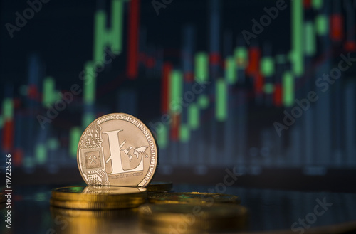 Litecoin crypoto currency coin with price market chart in the background