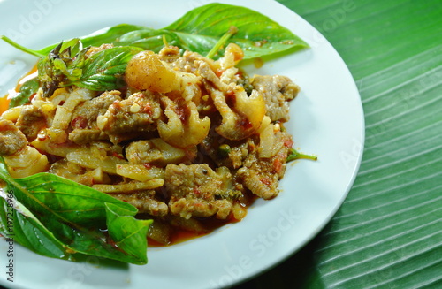 stir fried spicy wild boar and bamboo shoot with red curry on plate
