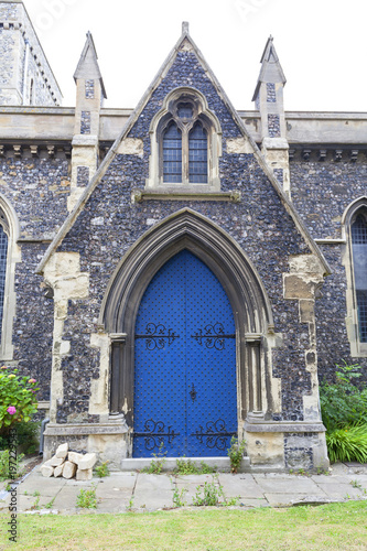 12th century Romanian style Church of St Mary the Virgin, blue door, Dover, United Kingdom