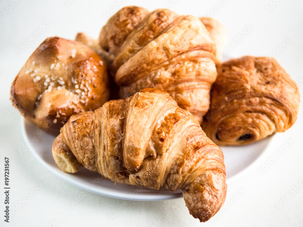 Variety of French croissants and buns Variety of French croissants and buns