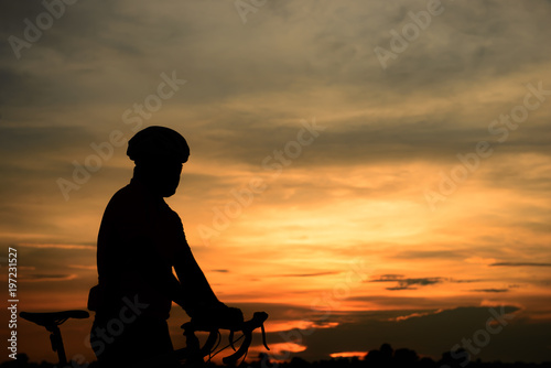 Silhouette of cyclists at sunset,Thailand people