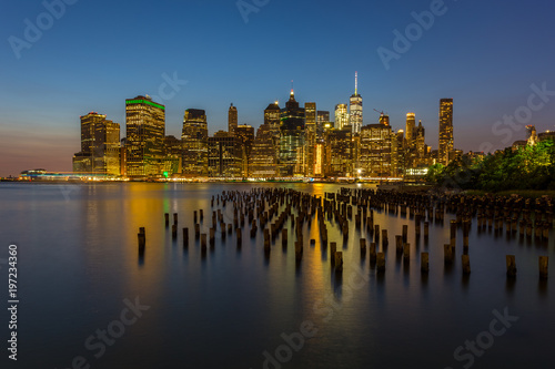 View on skyscrapers in lower Manhattan from Brooklyn skyline in New York City at night.