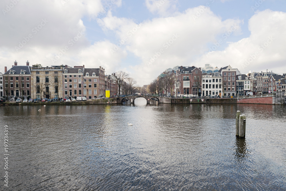 Obraz premium Amstel river canal in Amsterdam cityscape