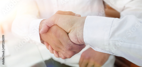 close-up handshake of business colleagues.