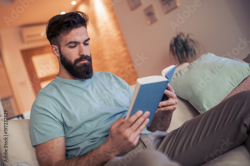  Young man reading a book