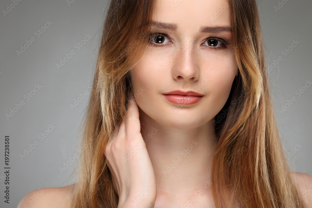 Beautiful girl, isolated on a light - grey background, emotion Beautiful girl, isolated on a light - grey background, emotion