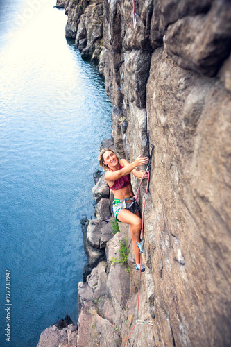 girl climbs the rock © zhukovvvlad