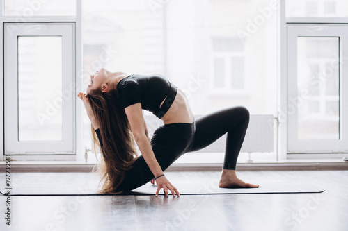Fototapeta Naklejka Na Ścianę i Meble -  Woman doing yoga fitness exercise and stretching for relax and healthy