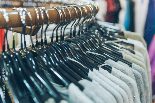 clothes on rack close up in store. shopping concept