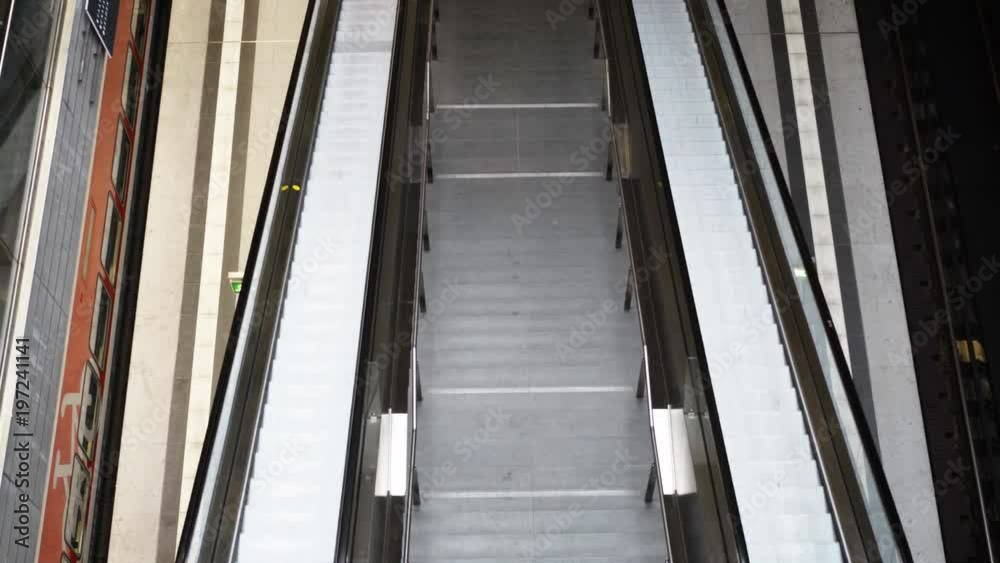 Handheld top view of an empty escalator in the Berlin Central Station. Real time shot Handheld top view of an empty escalator in the Berlin Central Station. Real time shot