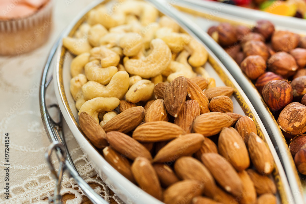bowl with mixed nuts such as almonds, hazelnuts and cashews. Healthy food and snack bowl with mixed nuts such as almonds, hazelnuts and cashews. Healthy food and snack