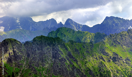 Poland, Tatra Mountains, Zakopane - Lodowy Szczyt, Jaworowe Szczyty, Swistowy, Zabi peaks under clouds and Lodowa Pass with High Tatra mountain range panorama in background