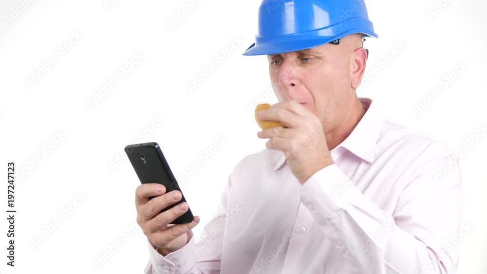 Serious Engineer Use Cellphone Eat Sandwich and Stay Thinking in Work Pause Serious Engineer Use Cellphone Eat Sandwich and Stay Thinking in Work Pause